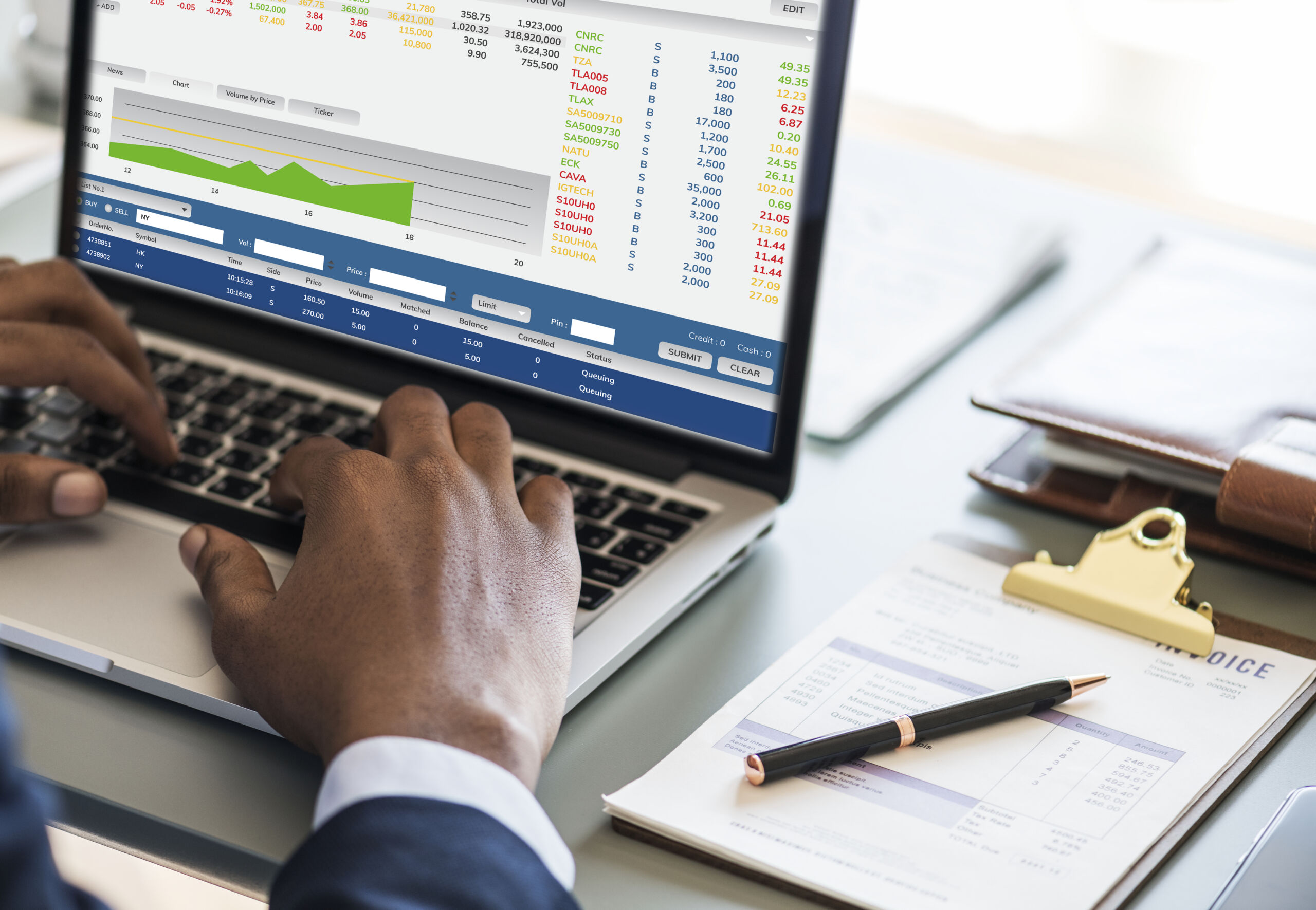 Businessman reviewing financial and accounting reports on a laptop